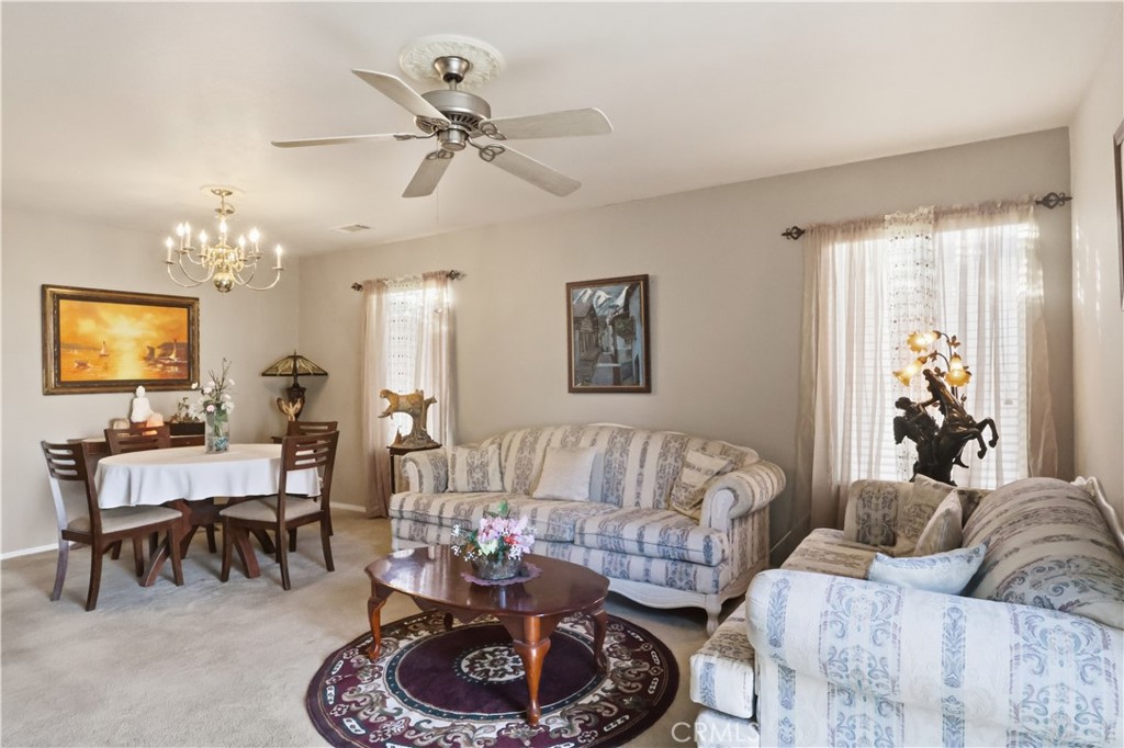 19020 Stoddard Way Apple Valley, CA 92308 - Photo 6 of 32 Living room with a laege window and sliding dootr.