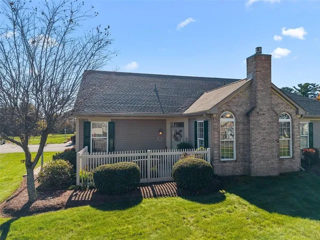 a front view of a house with patio