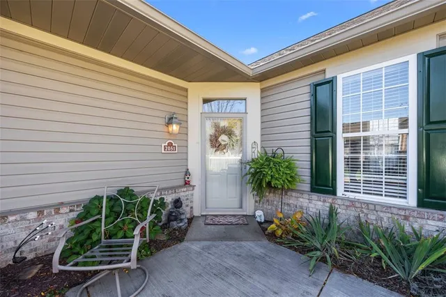a potted plant sitting in front of a house