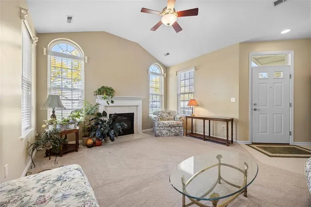 a bedroom with furniture and a fireplace