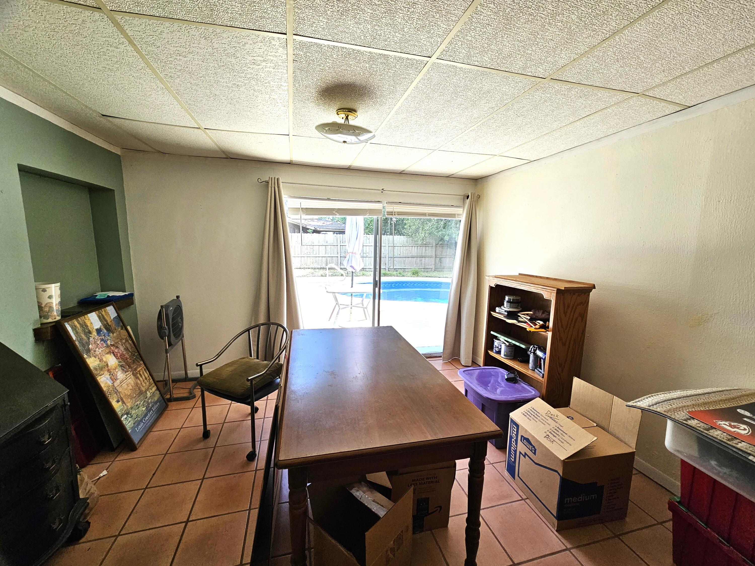 13 10th Street Shalimar, FL 32579 - Photo 11 of 17 a view of a room with furniture and a window