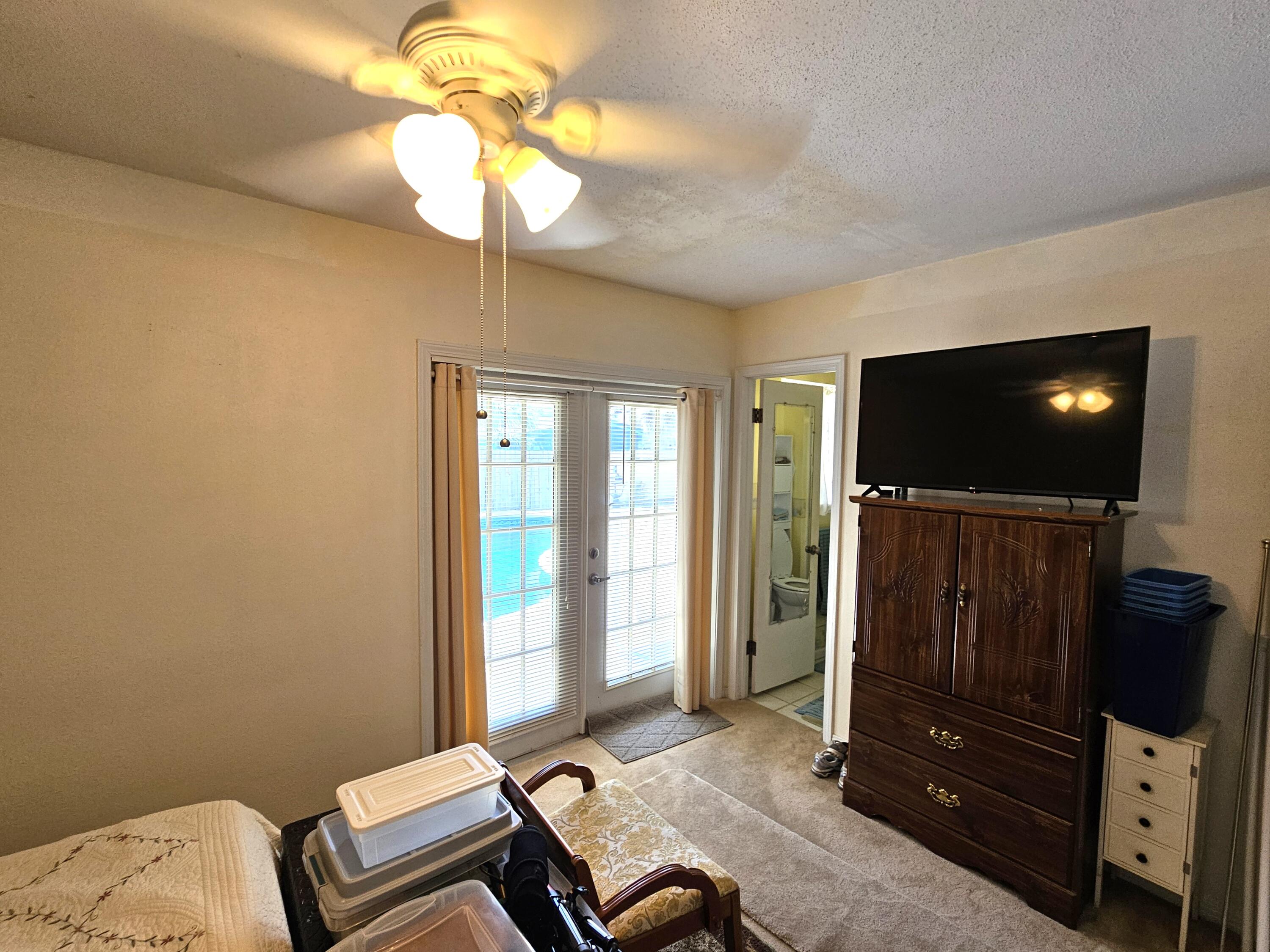 13 10th Street Shalimar, FL 32579 - Photo 13 of 17 a living room with furniture and a flat screen tv