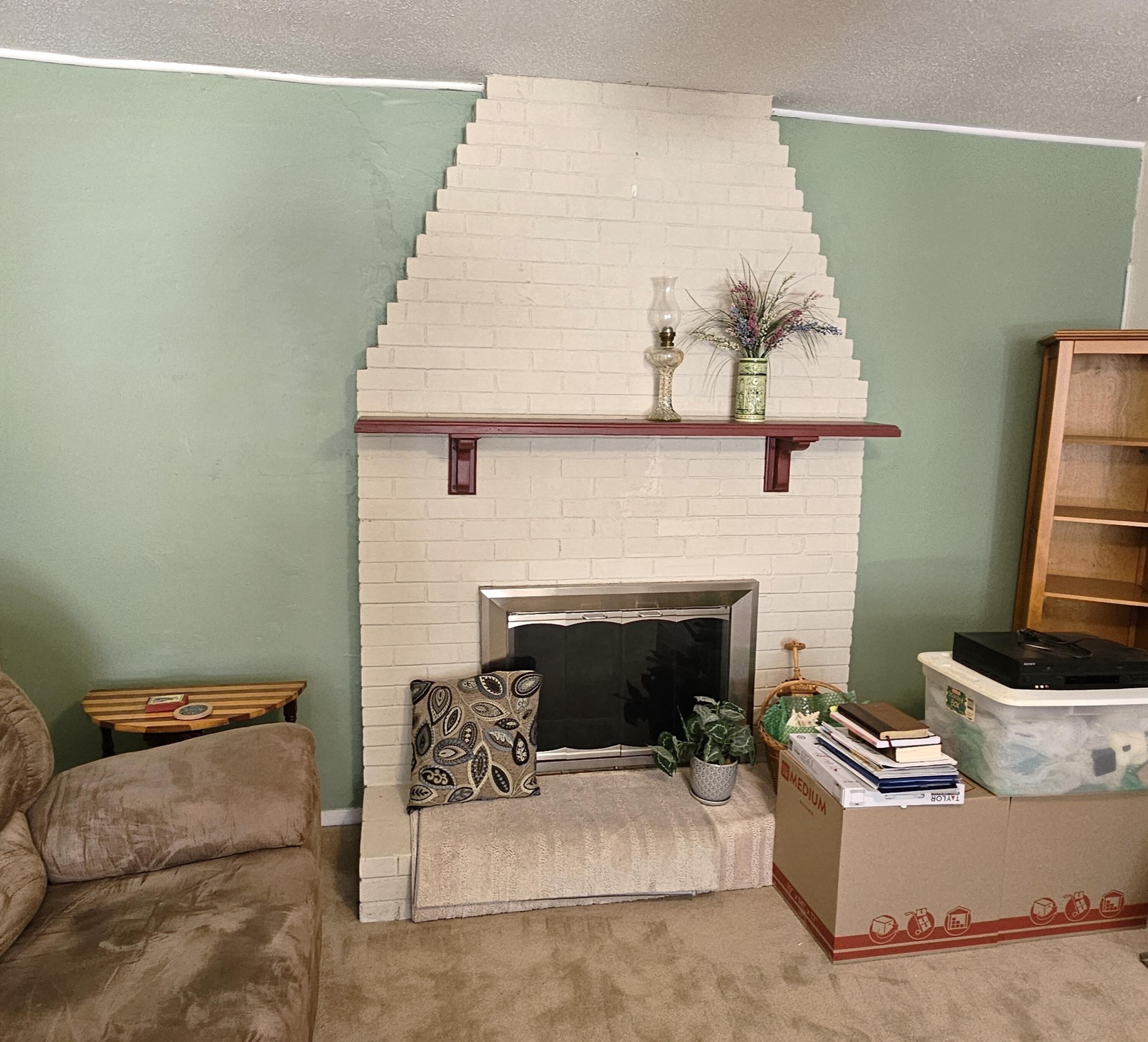 13 10th Street Shalimar, FL 32579 - Photo 10 of 17 a living room with furniture and a fireplace