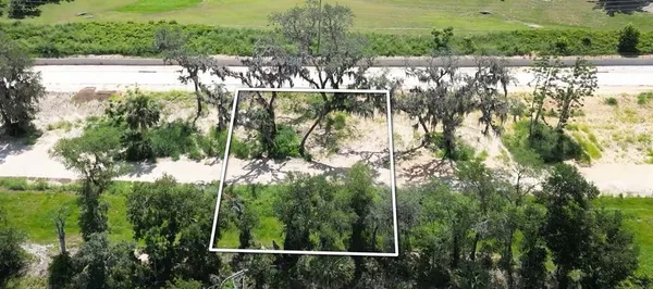 a view of a lake with a yard