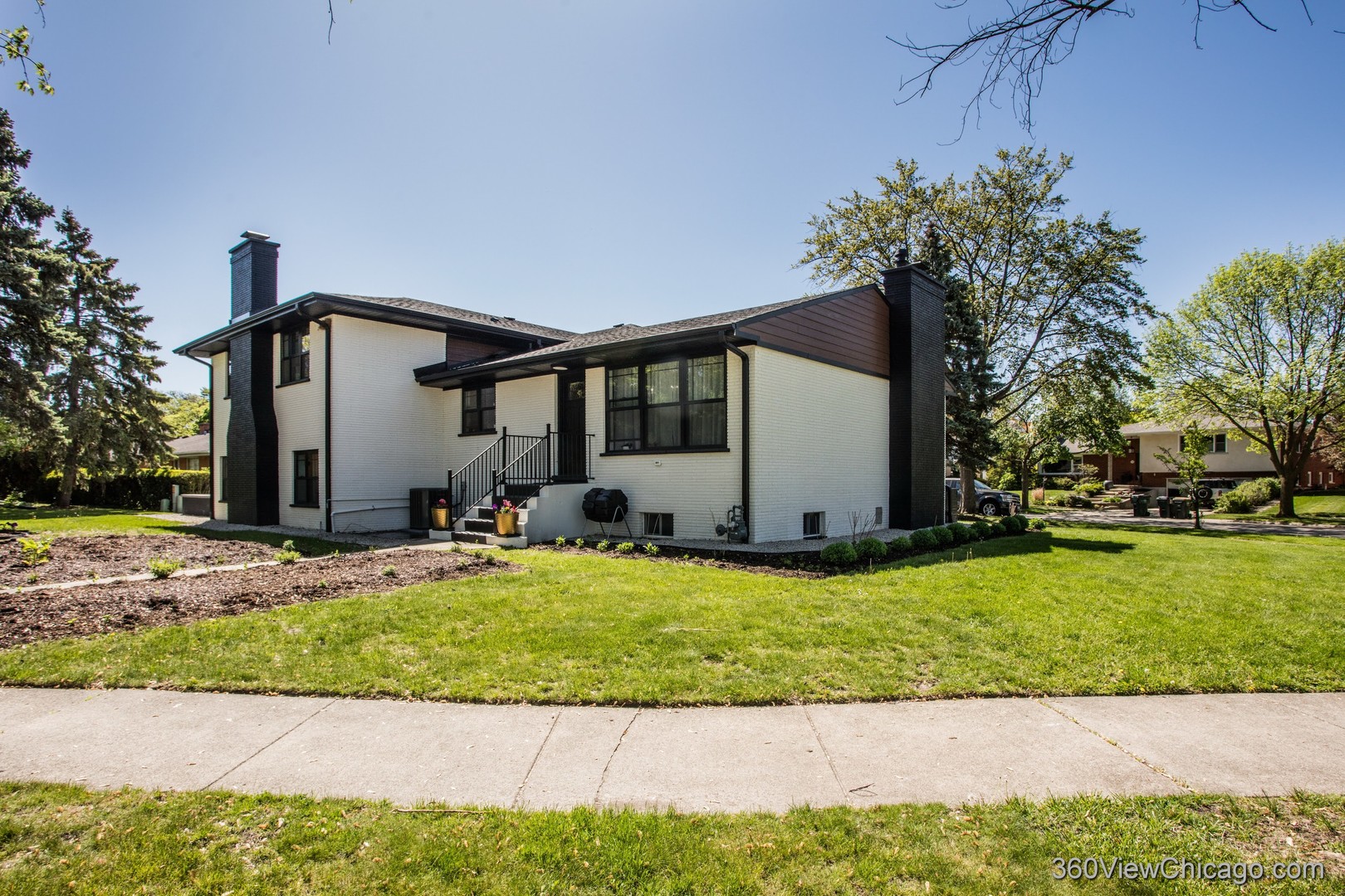 108 East Edgemont Lane Park Ridge, IL 60068 - Photo 4 of 11 a view of a house with a big yard plants and large tree