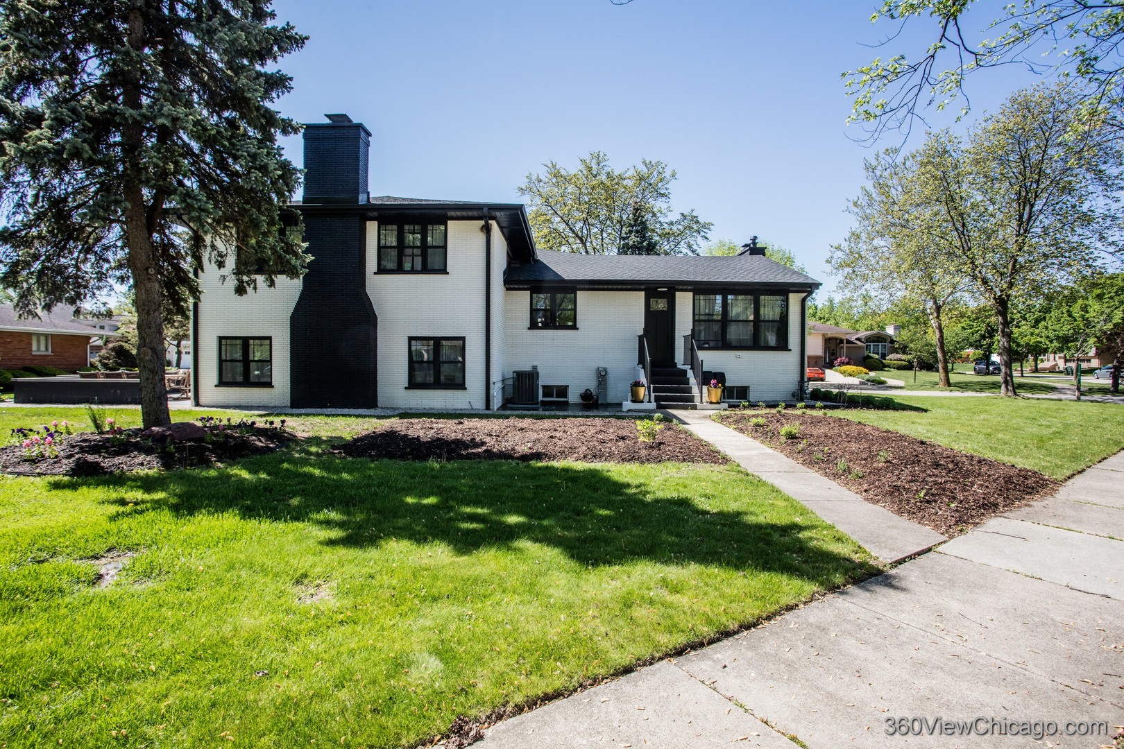 108 East Edgemont Lane Park Ridge, IL 60068 - Photo 5 of 11 a front view of a house with a yard