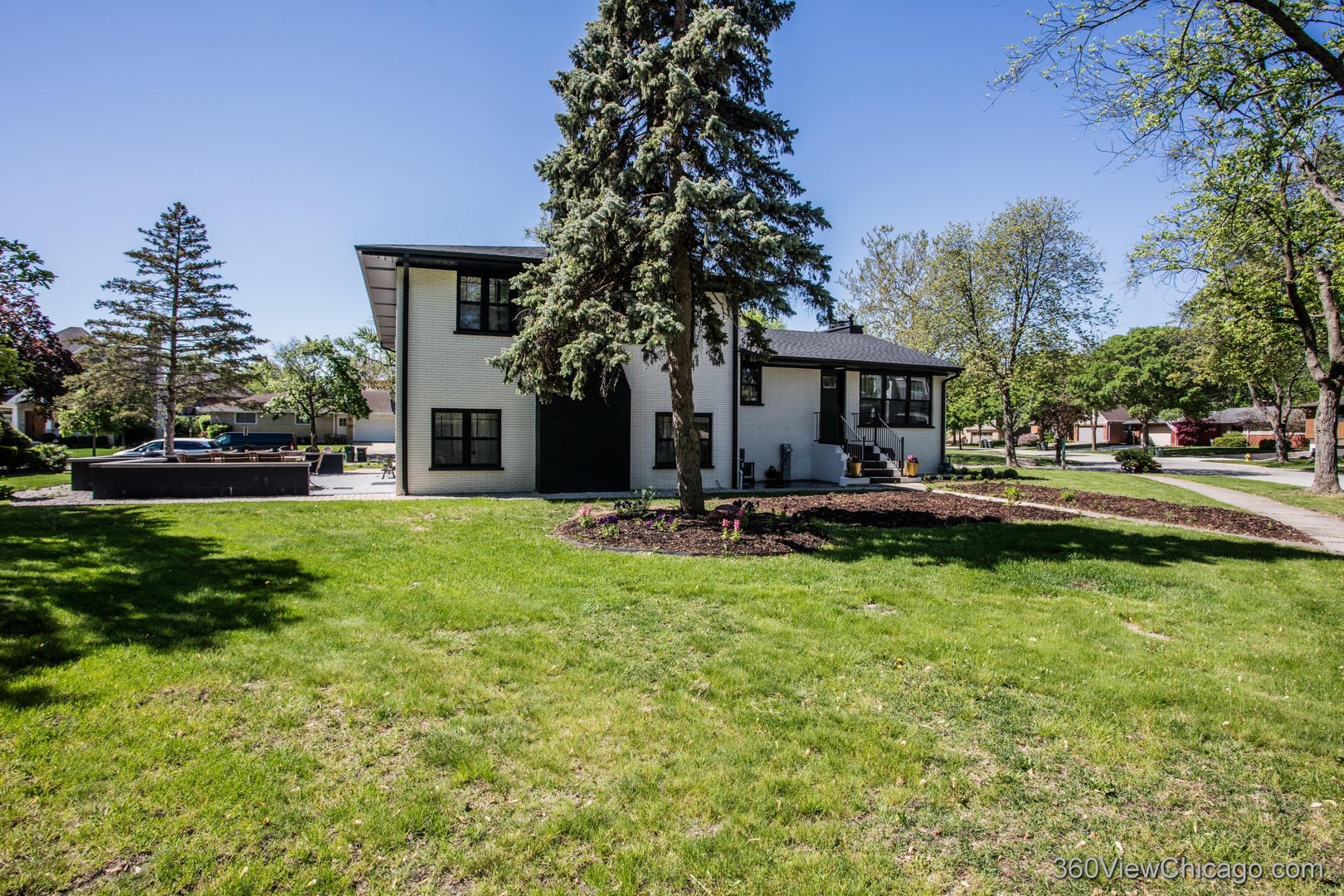 108 East Edgemont Lane Park Ridge, IL 60068 - Photo 6 of 11 a front view of a house with garden and trees