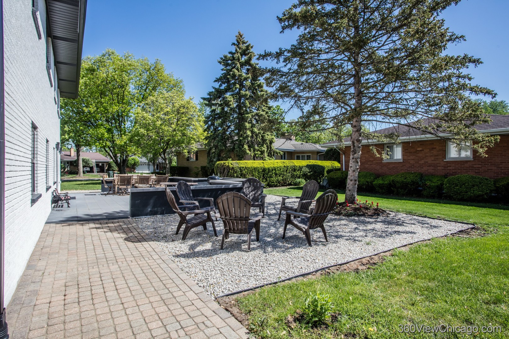 108 East Edgemont Lane Park Ridge, IL 60068 - Photo 8 of 11 a view of a patio with table and chairs potted plants and large tree