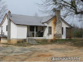 250 Tobacco Road Mill Spring, NC 28756 - Photo 1 of 7 a front view of a house with a yard