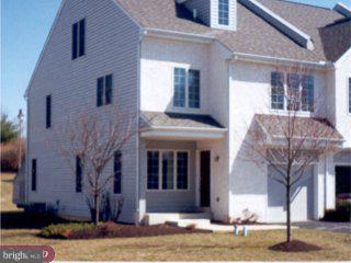 309 Newport Place Exton, PA 19341 - Photo 1 of 2 a front view of a house with a yard