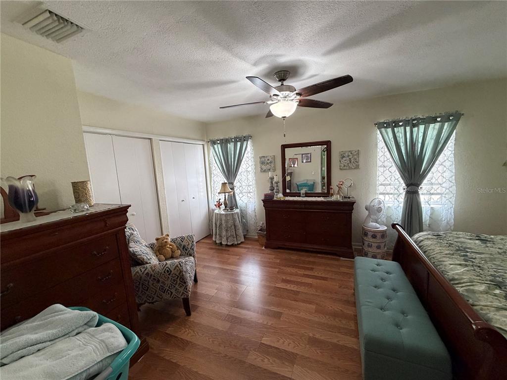 7016 Filbert Lane Temple Terrace, FL 33637 - Photo 13 of 31 a living room with furniture and a wooden floor