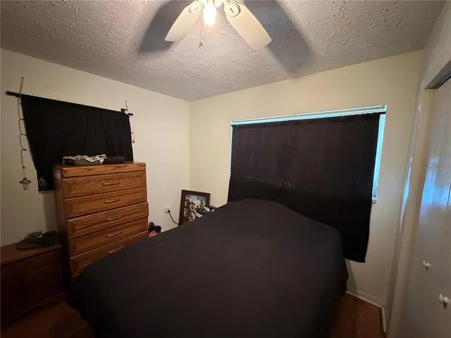 a bedroom with bed and a window