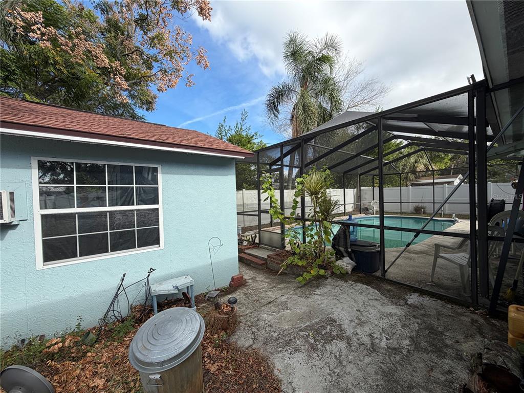 7016 Filbert Lane Temple Terrace, FL 33637 - Photo 27 of 31 a view of a chair and table in backyard of the house