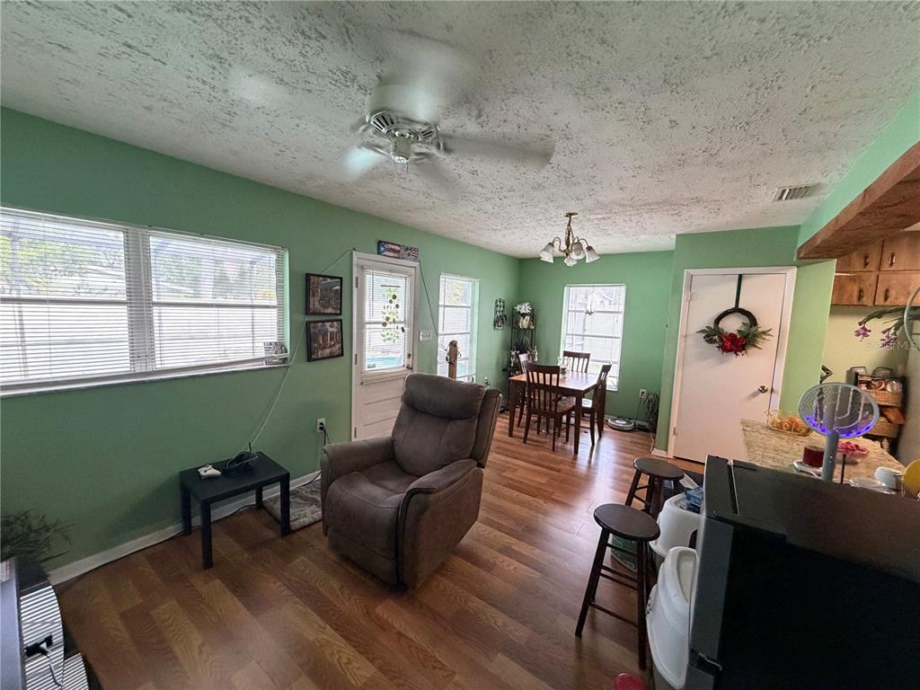 7016 Filbert Lane Temple Terrace, FL 33637 - Photo 6 of 31 a living room with furniture and a wooden floor