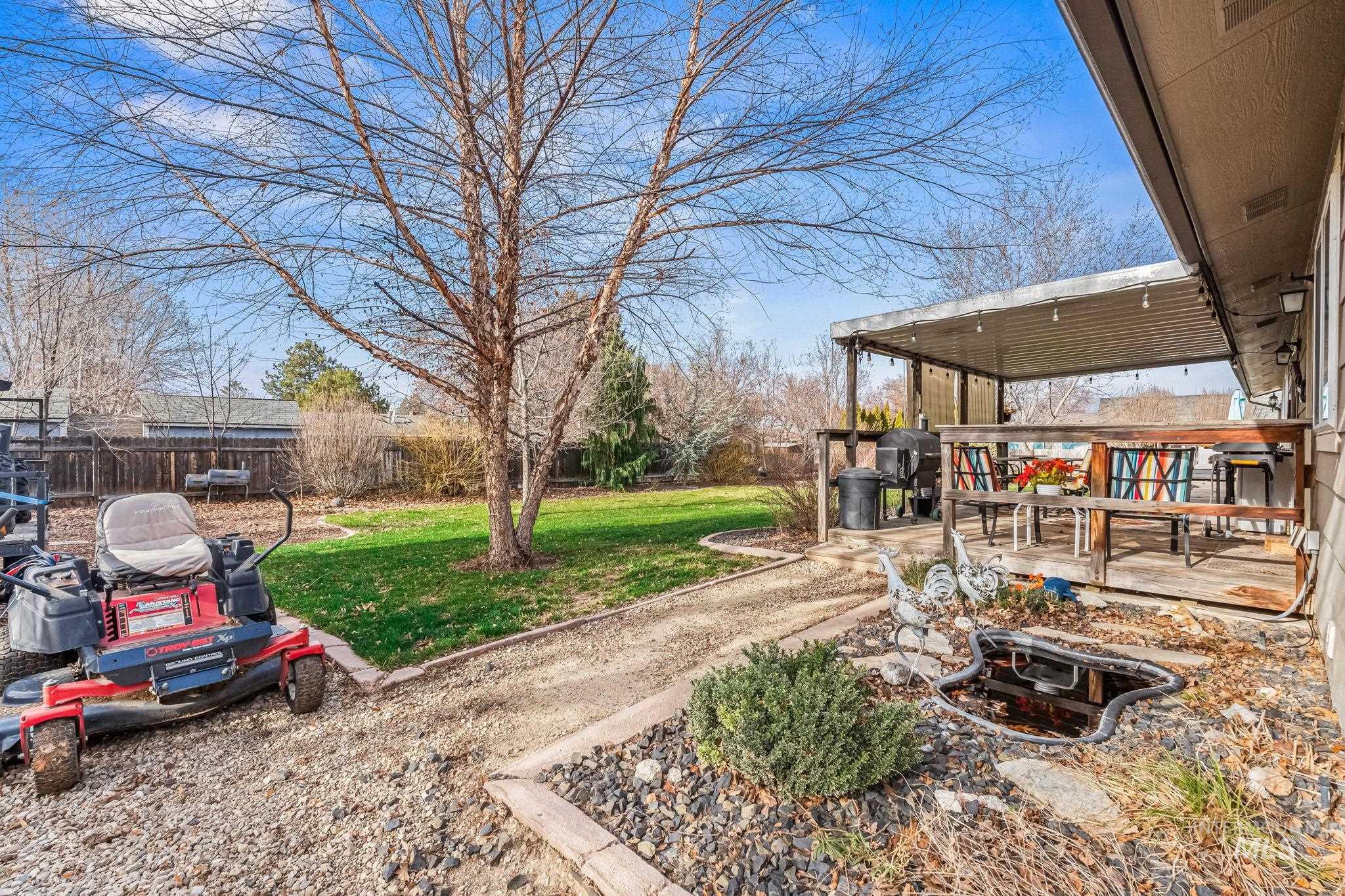 7650 West Colt Drive Boise, ID 83709 - Photo 23 of 30 View of yard featuring a deck