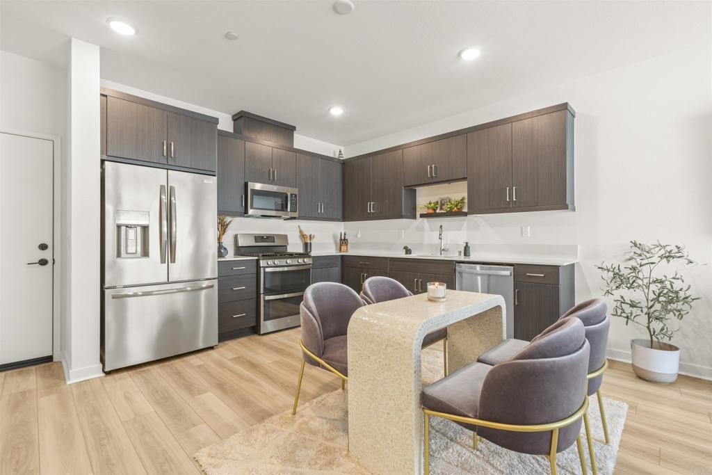 35173 Grove Trail Fallbrook, CA 92028 - Photo 12 of 30 a kitchen with a refrigerator and a stove top oven