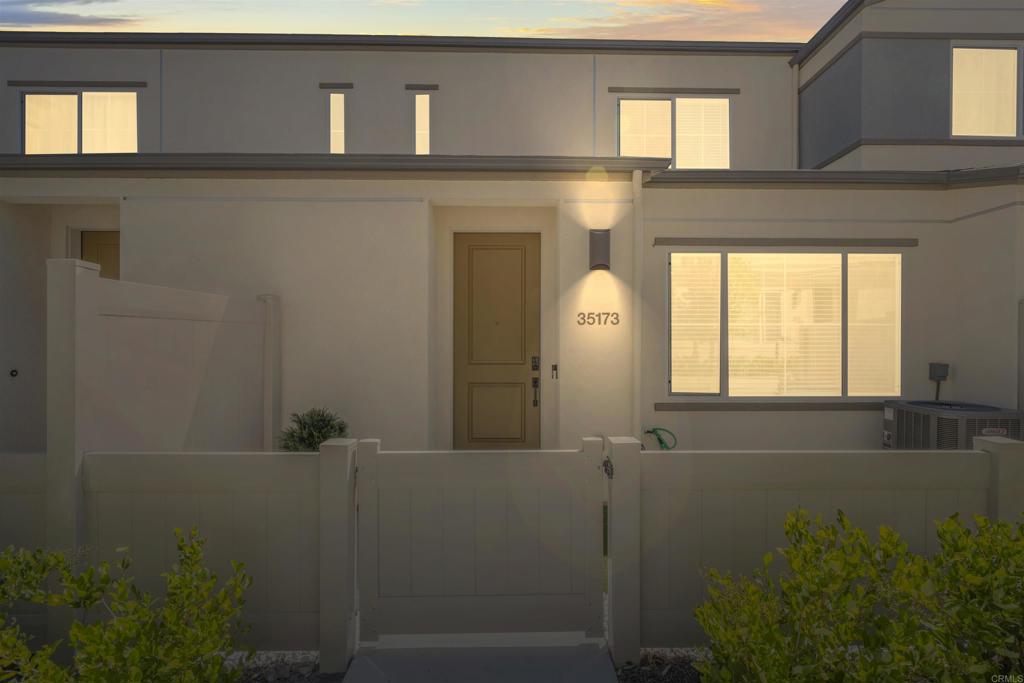 35173 Grove Trail Fallbrook, CA 92028 - Photo 2 of 30 a bathroom with a sink a mirror and a window