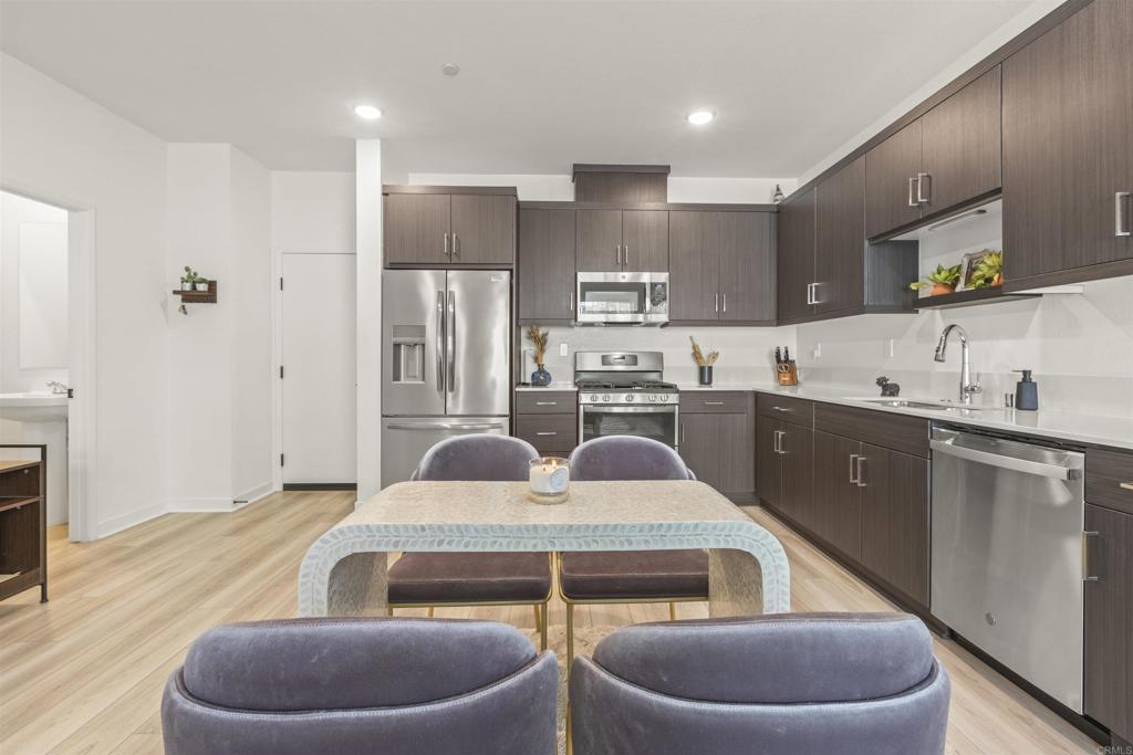 35173 Grove Trail Fallbrook, CA 92028 - Photo 10 of 30 a kitchen with a sink refrigerator and cabinets