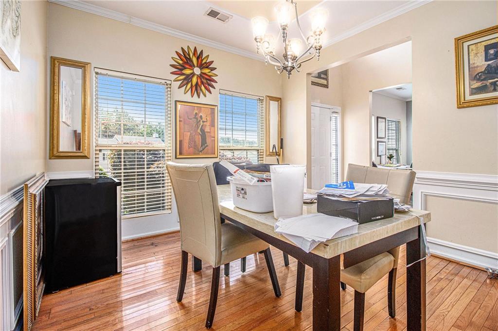 474 Boxelder Road Atlanta, GA 30349 - Photo 4 of 25 a view of a dining room with furniture window and wooden floor