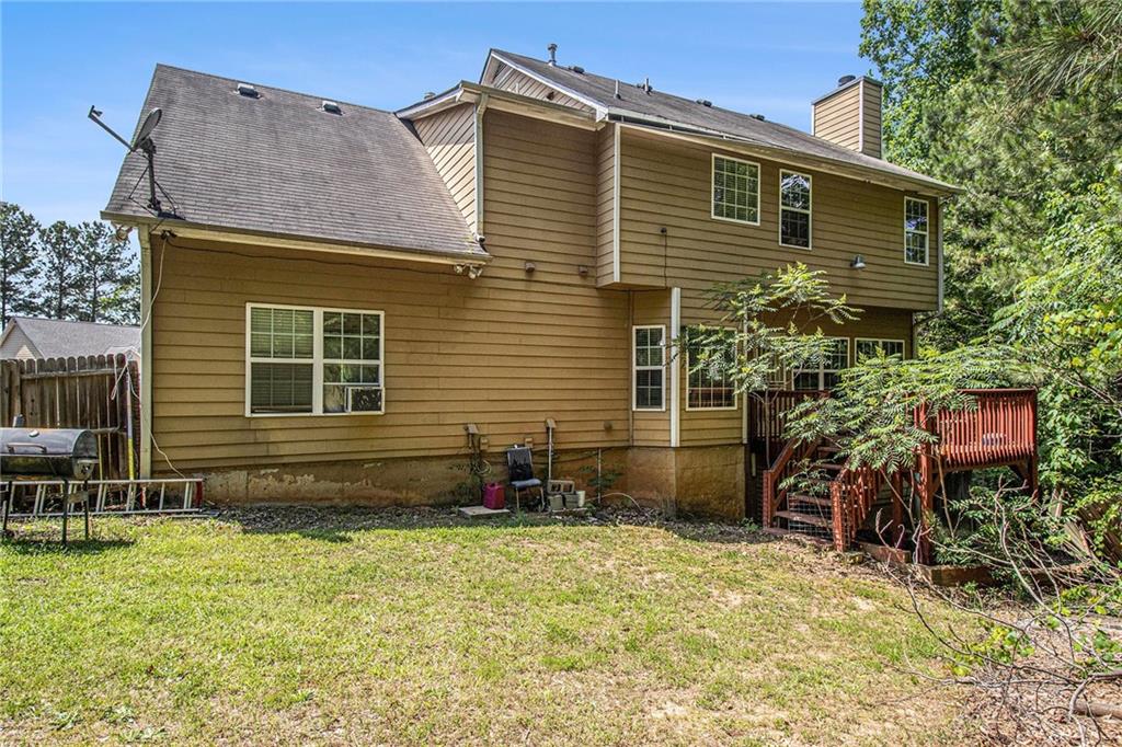 474 Boxelder Road Atlanta, GA 30349 - Photo 5 of 25 a view of house with a yard