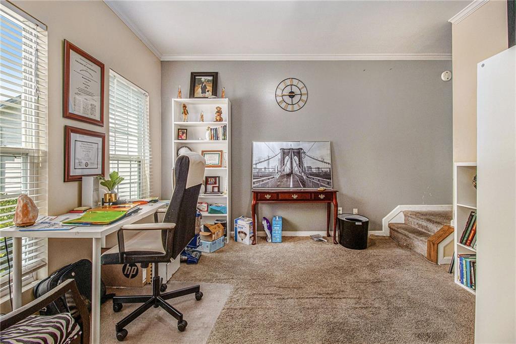 474 Boxelder Road Atlanta, GA 30349 - Photo 8 of 25 a view of a workspace with furniture and a window
