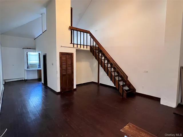 a view of an entryway with wooden floor