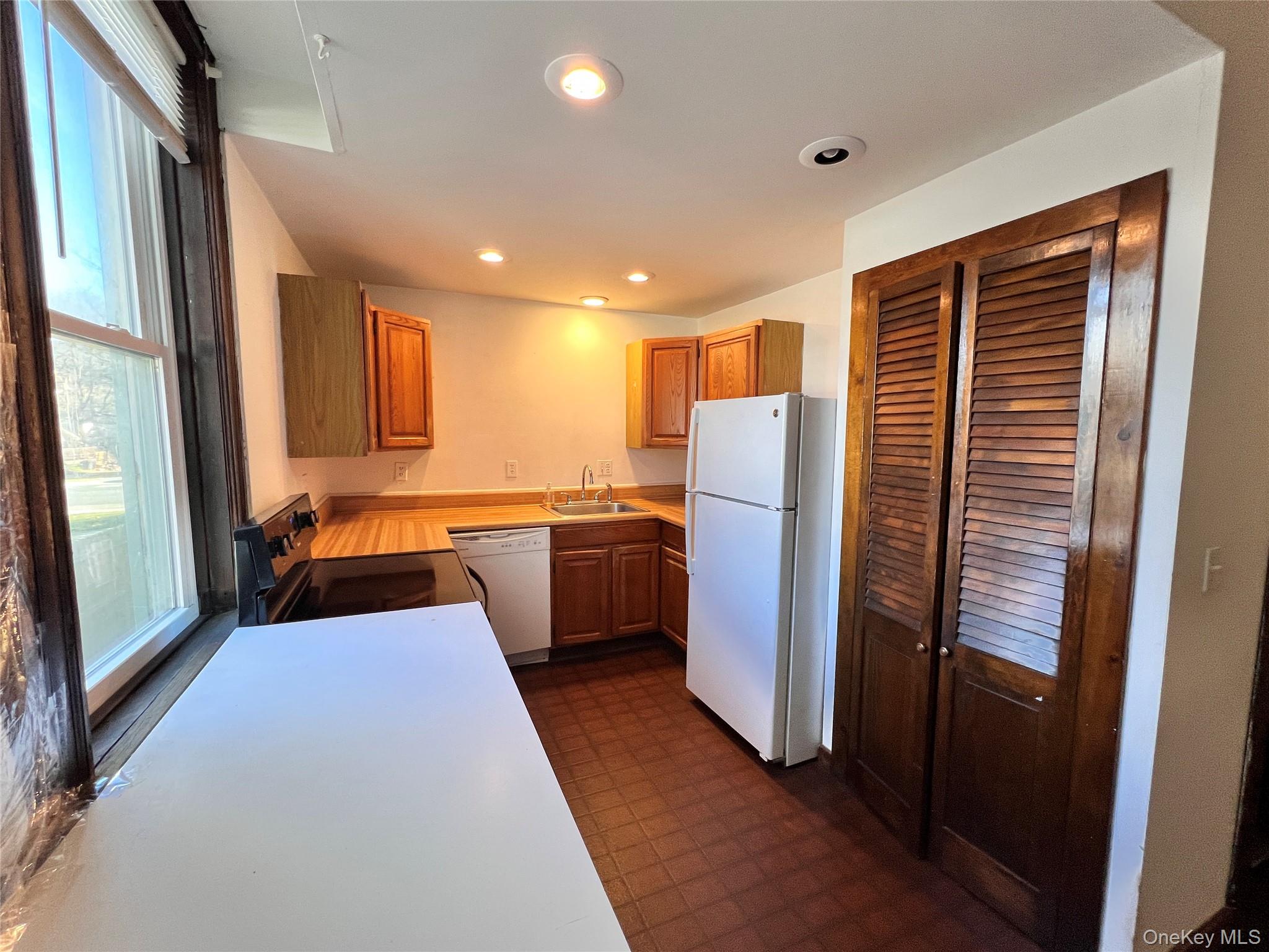12 Bridge Cornwall, NY 12518 - Photo 6 of 11 a kitchen with stainless steel appliances a refrigerator and a sink