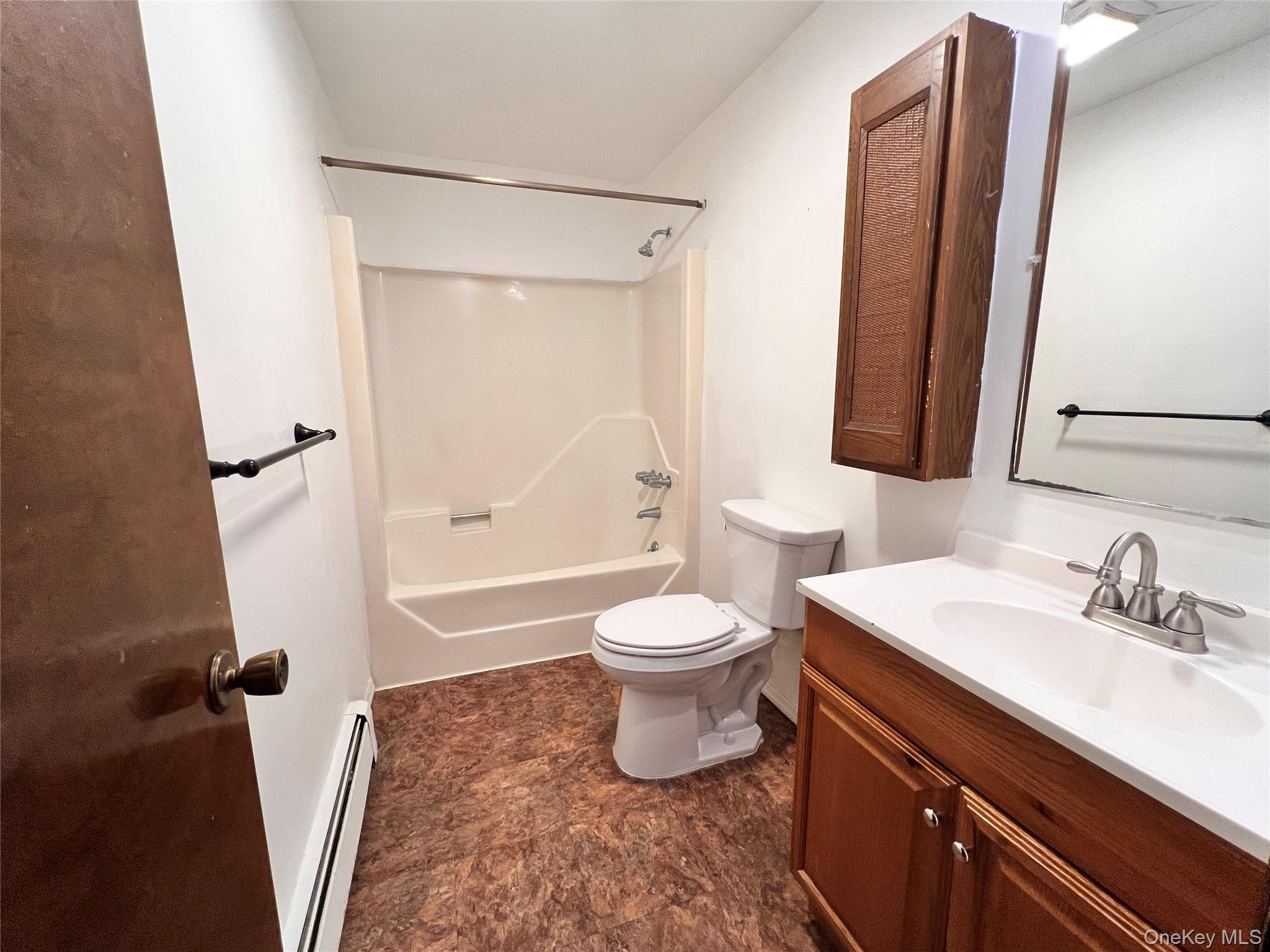 12 Bridge Cornwall, NY 12518 - Photo 7 of 11 a bathroom with a sink a toilet a mirror and shower