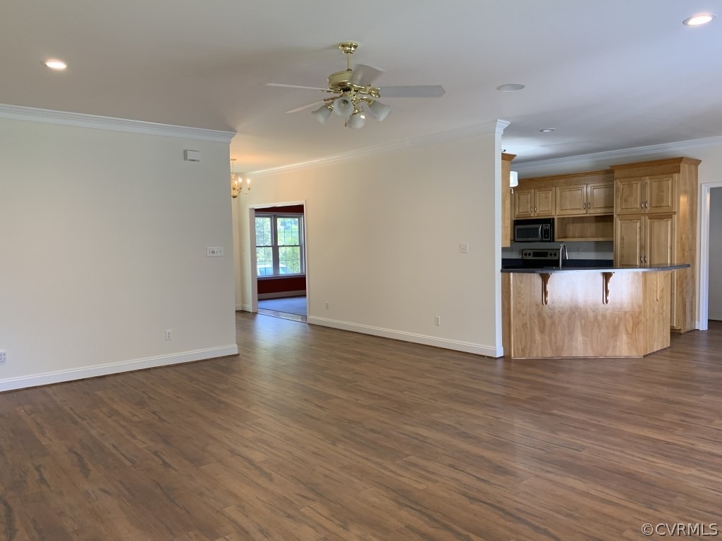 4108 Hidden Valley Road Chester, VA 23831 - Photo 11 of 15 a view of a livingroom with wooden floor and a ceiling fan