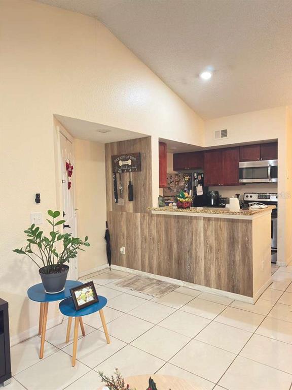 5100 Conroy Road, Unit 26 Orlando, FL 32811 - Photo 2 of 10 a living room with a couch and chairs