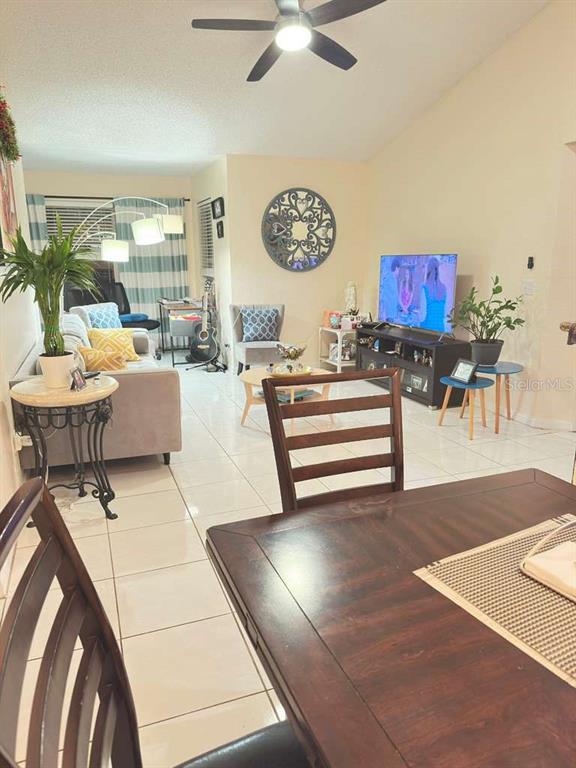 5100 Conroy Road, Unit 26 Orlando, FL 32811 - Photo 3 of 10 a living room with furniture and a floor to ceiling window