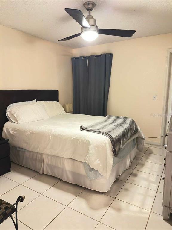 5100 Conroy Road, Unit 26 Orlando, FL 32811 - Photo 10 of 10 a bedroom with a bed and a walk in closet