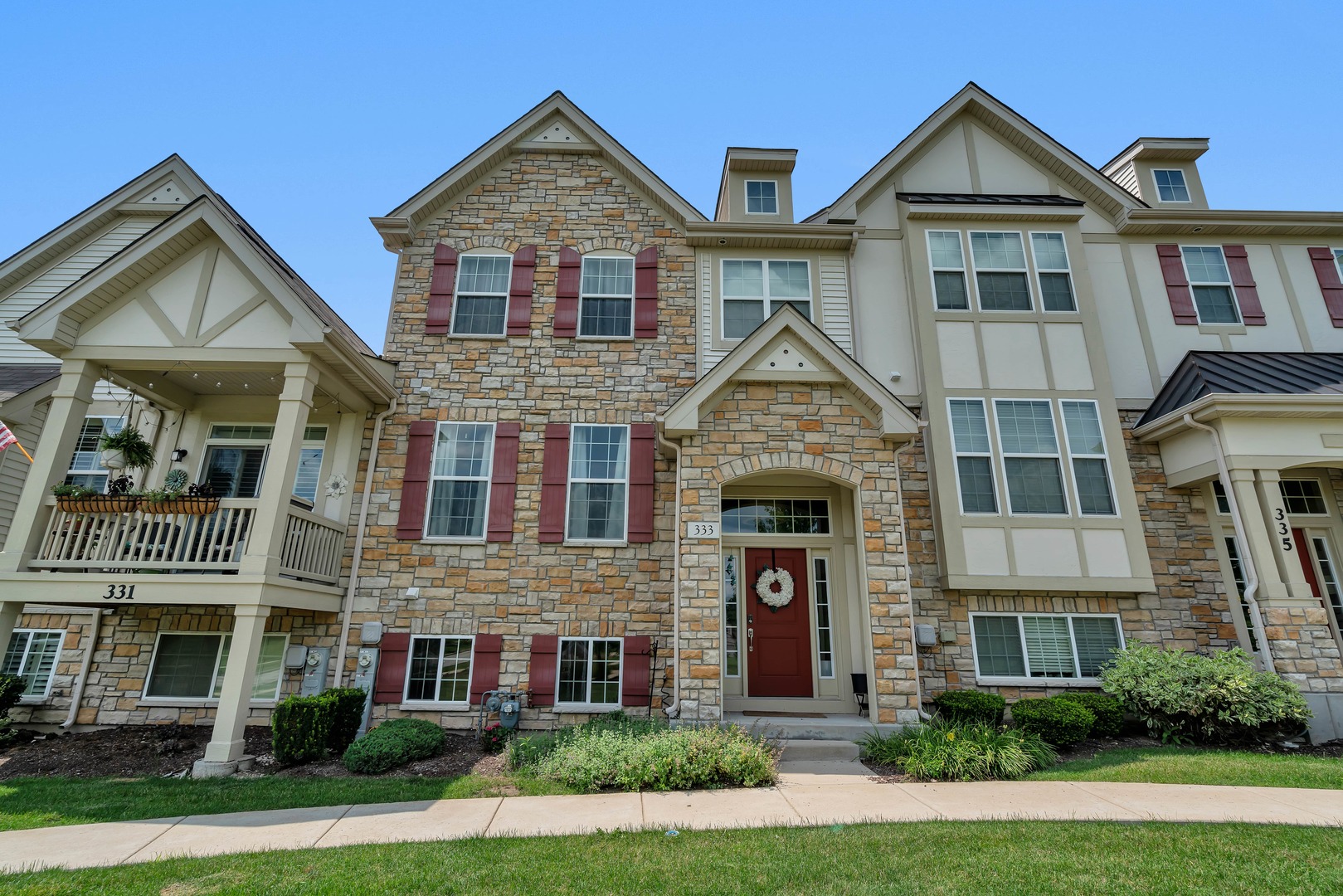 333 Bennett Drive Carol Stream, IL 60188 - Photo 1 of 22 front view of residential houses with a yard