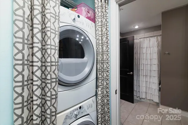 a view of a hallway with washer and dryer