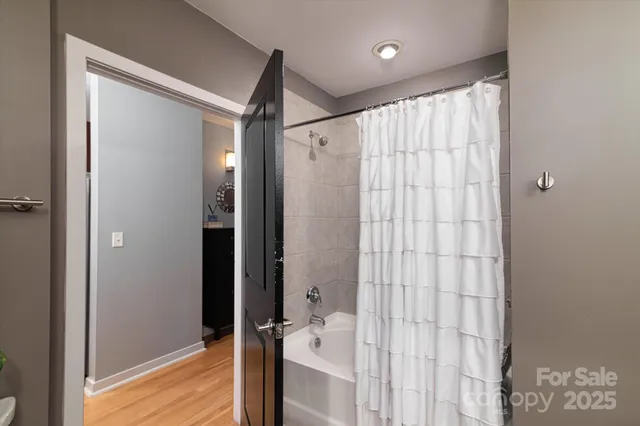 a bathroom with a shower and a tub