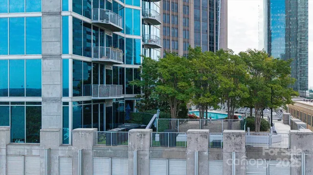 a view of building with yard and staircase