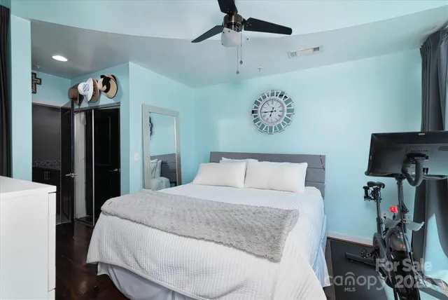 a bed room with a bed and a television