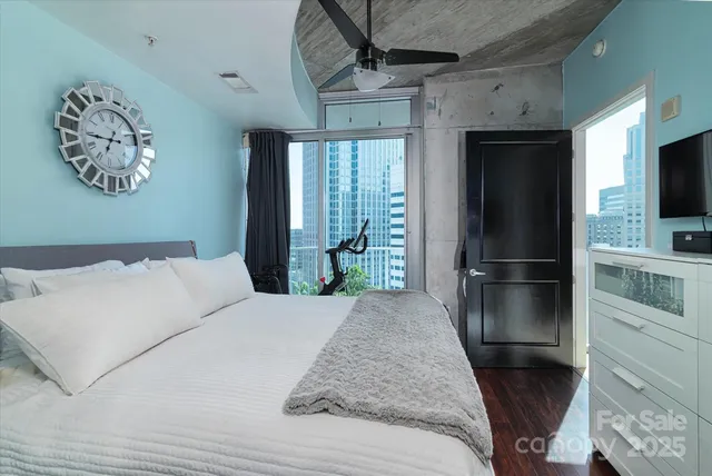 a bedroom with a bed and a television