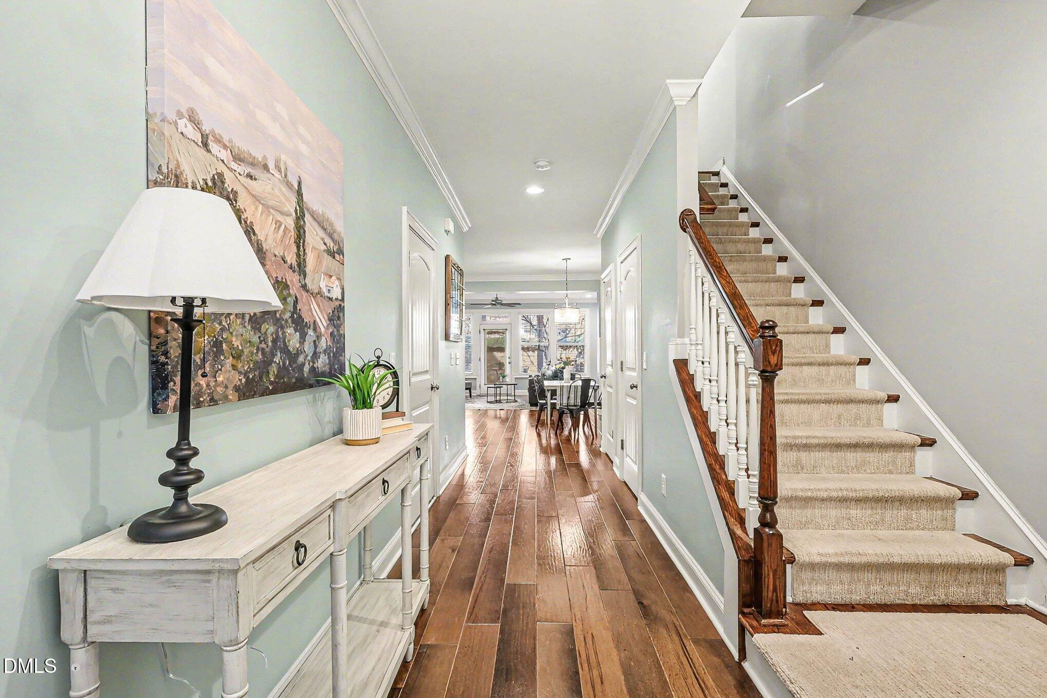 653 Fallon Grove Way Raleigh, NC 27608 - Photo 4 of 38 a view of a living room and entryway