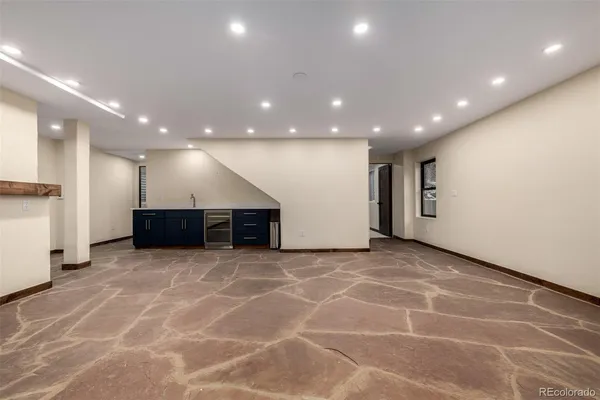 a view of a hall with kitchen and a window