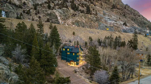 a view of wooden house with a large windows