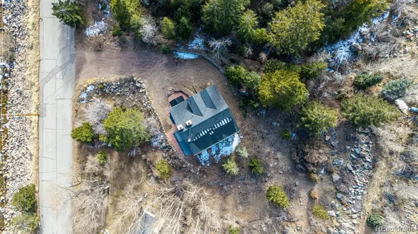 a view of a yard with wooden fence