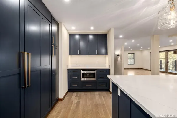 a large kitchen with stainless steel appliances granite countertop a large counter top