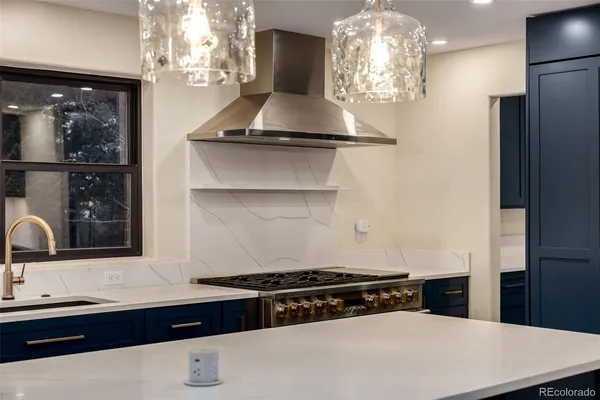 a kitchen with a sink and a refrigerator
