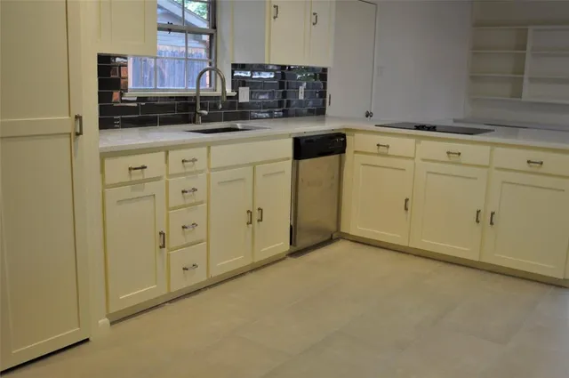 a view of a kitchen with cabinets