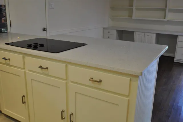 a kitchen with a sink and cabinets