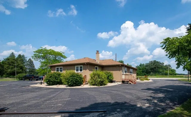 a view of a house next to a yard