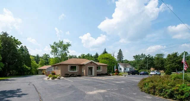 a front view of a house with garden