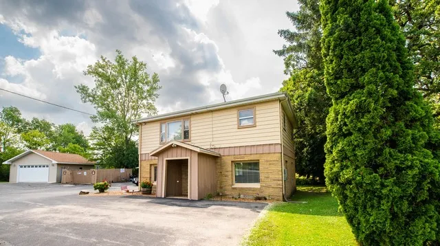 a view of a house with a yard