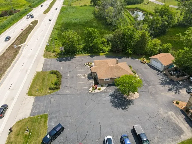 an aerial view of a house with a garden